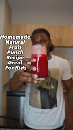 a man holding a drink in his hand with the caption homemade natural fruit punch recipe great for kids