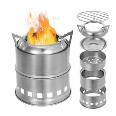 a metal pot with flames in it next to other pots and pans on a white background