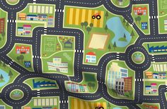 an image of a child's play mat with cars and roads on it in green