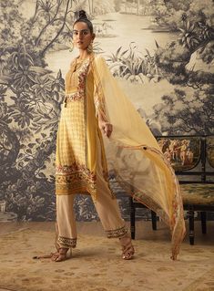 Editor's Note Featuring a true-to-size straight kurta adorned with katdana and hand embroidery on the front yoke. It is styled with a coordinated printed dupatta and contrast straight pants. Fabric: Kurta: crepe, pants: cotton silk, dupatta: georgette Color: Yellow Components: Kurta, pant and dupatta Occasion: Festive Care: Dry Clean Only About the Designer Kalista is a luxury fashion label that specializes in designer clothing for millennial women. Founded by fashion designer turned entrepreneu Yellow Gharara, Green Anarkali, Yellow Kurta, Printed Dupatta, Checkered Print, Straight Kurta, Embroidery Suits, Yellow Shorts, Lace Border