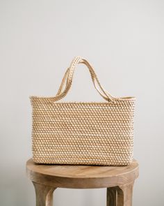 The Magnolia Straw Market Tote is lightweight and durable. This medium-size bag is perfect for a day at the beach, a trip to the market, or for everyday use. It's the ideal multi-purpose tote. These totes are individually hand-woven with sustainable palm leaves. Thoughtfully designed and ethically made by artisans in Guerrero, Mexico, in a fair trade environment. Each tote is unique and may vary in size, and color, and may have small imperfections. Hand-woven sustainable palm leaves Natural colo Everyday Braided Straw Tote Bag, Eco-friendly Braided Beach Bag, Everyday Rectangular Braided Straw Bag, Everyday Braided Basket Beach Bag, Braided Jute Beach Bag For Everyday, Everyday Braided Jute Beach Bag, Everyday Braided Rectangular Straw Bag, Everyday Rectangular Braided Beach Bag, Everyday Natural Braided Beach Bag