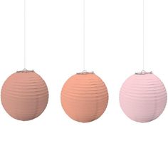 three different colored paper lanterns hanging from strings