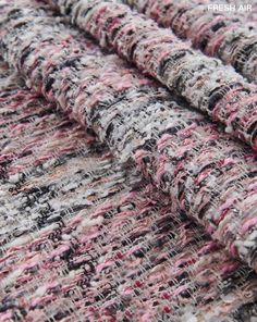 the fabric is very colorful and looks like it has been dyed with pink, white and black