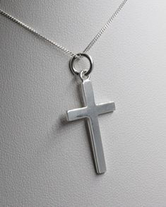 Beautiful simple and elegant sterling silver cross.  The cross measures 3cm in length by 1.5cm in width and hangs on a sterling silver curb chain (please choose desired length from drop-down menu). Wrapped in tissue paper and presented in an organza pouch. Upgrade to box available in shop. Simple Sterling Silver Cross Pendant Necklace, Minimalist Sterling Silver Cross Pendant Necklace, Minimalist Sterling Silver Cross Necklace, Minimalist Sterling Silver Crucifix Necklace, Everyday Sterling Silver Crucifix Necklace, Minimalist Sterling Silver Pendant Cross Necklace, Minimalist Silver Cross Necklace, Minimalist White Gold Sterling Silver Cross Necklace, Pendant Minimalist