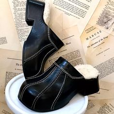 Free People Miista Addie Cozy Clogs Mules Fur Lined Black Leather Seamed Leather Uppers * Shearling Fur Lining * Chunky Throwback New Without Box * Size: 38 / 7.5 Retail Price: $405.00 1.5" Front Hidden Platform * 2.25" Wedge Heel Winter Clogs With Wooden Heel And Round Toe, Winter Mules With Rubber Sole And Round Toe, Retro Leather Mules With Round Toe, Chic Black Clogs With Padded Heel, Winter Closed Toe Clogs With Leather Sole, Winter Leather Closed Toe Mules, Black Round Toe Mules For Winter, Winter Black Mules With Round Toe, Black Mules With Rubber Heel Cap