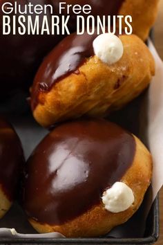 chocolate covered doughnuts with white frosting in a box