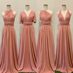 four bridesmaid dresses are lined up on mannequins