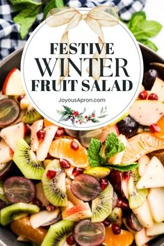 festive winter fruit salad in a bowl with the title overlay