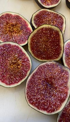 a bowl filled with sliced up figs on top of a table