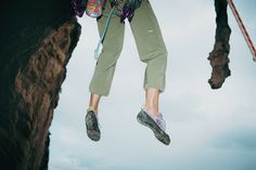 a man is suspended in the air by ropes