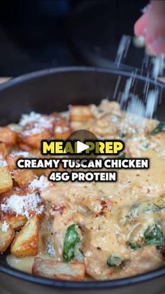 someone is sprinkling gravy on some food in a skillet with the words meanprep creamy tuscan chicken 45g protein