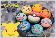 some pokemon cupcakes are in a bowl on a table