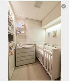 a baby's room with a crib, dresser and changing table in it