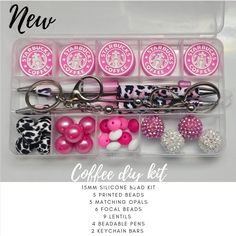 the starbucks keychain is filled with pink, white and black items