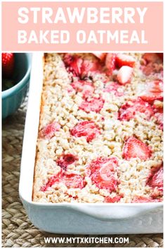 strawberry baked oatmeal in a white baking dish with strawberries on top