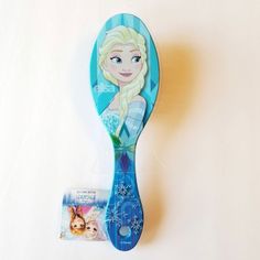 a blue toothbrush with a frozen princess image on it