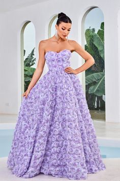 This gown is a masterpiece of tailoring, featuring precise lines and a stunning 3-dimensional floral pattern throughout. The midrise back and concealed zipper closure provide a seamless look, while the strapless bodice and sweetheart neckline add a touch of romance. The A-line silhouette flows gracefully, culminating in a delicately shaped skirt with pockets and a sweep train for a captivating finish. Ethereal Skirt, Texture Allover, Jadore Dress, Long A Line Skirt, Rose Colors, Vintage Ball Gowns, Lavender Orange, Floral Prom Dresses, Floral Texture