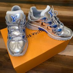 Blue & Silver Lv Sneakers Designer Metallic Low-top Sneakers, Luxury Silver Sneakers With Metallic Logo, Luxury Silver Custom Sneakers, Blue Louis Vuitton, Lv Sneakers, Louis Vuitton Sneakers, Shoes Silver, Louis Vuitton Shoes, Silver Shoes