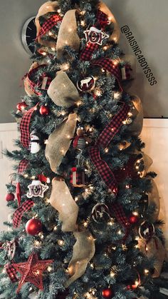 a christmas tree decorated with red and gold ornaments