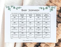 a baby shower game is displayed on a blanket with teddy bears and blankets around it