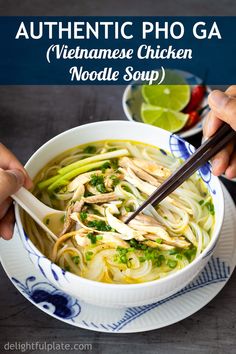 someone holding chopsticks in a bowl of vietnamese chicken noodle soup with text overlay