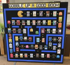 a board game made to look like a pacman maze with the words gobble up a good book on it