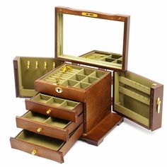 an assortment of wooden jewelry boxes with gold hardware on the top and bottom, all open