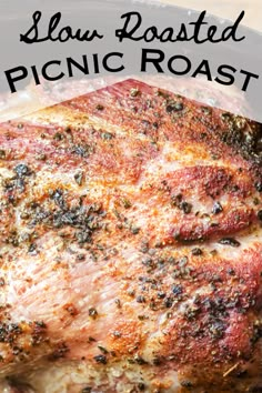 a close up of a piece of meat on a plate with the words slow roasted picnic roast