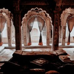 the interior of an old building with arches and pillars