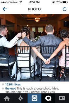 the bride and groom are sitting at the table