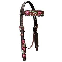 a horse bridle with pink flowers and green leaves on the front, brown leather reins