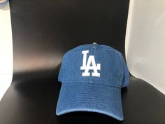 Dodgers Hat, adult adjustable NEW WITH TAG, Russell Athletic 100% Cotton, dad hat, curved bill, unstructured. More hat info: Casual Trucker Hat With Letter Print And Curved Bill, Casual Trucker Hat With Letter Print And Flat Bill, Spring Streetwear Curved Bill Hat, Blue Letter Print Dad Hat For Streetwear, Casual Trucker Hat With Letter Print For Baseball Season, Casual Blue Trucker Hat With Letter Print, Casual Baseball Hats With Letter Print, Casual Baseball Cap With Letter Print And Curved Visor, Casual Letter Print Trucker Hat For Baseball Season