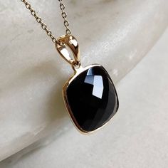 This stunning pendant is set in 14K Solid Yellow Gold with Natural Black Onyx with utmost precision. It is an unique gemstone pendant for nearly every occasion and is completely hassle-free jewelry. ITEM DETAILS * Gem: Black Onyx * Gem Size: 12X12mm * Gem Shape: Square * Gem Weight: 6.85 carats * Gold Purity: 14KT  * Gold Weight: 0.56 gram * Total Weight of the Pendant: 1.93 gram The Gold purity is guaranteed and it comes with authentic 14KT gold hallmark. Since my items are handmade, they are absolutely nickel and lead free. CUSTOMIZATION * Gemstone customization is available and it can be substituted with a gem of your choice. Kindly message me for the same. PACKAGING * The Pendant comes with layers of safe and secure wrapping along with Free handmade jewelry box with every purchase. ➡️H Black 14k Gold Pendant Jewelry, Black Pendant Jewelry For Anniversary, Black Enamel Necklace For Anniversary, Black Pendant Necklaces For Anniversary, Black Faceted Jewelry As A Gift, Black Faceted Jewelry For Gift, Black Necklaces With Birthstone For Anniversary, Black Birthstone Necklaces For Anniversary, Black Birthstone Necklace For Anniversary