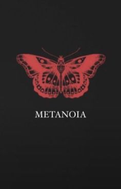 a red and black butterfly with the words metanoia on it's back