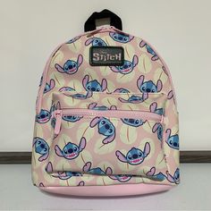 Disney Lilo & Stitch By Bioworld Mini Backpack -Os -Multi -All-Around Stitch Character Print -Pink Zipper Closure -One Large Main Zippered Compartment -One Exterior Zippered Pocket -Adjustable Padded Shoulder Straps -Approximate Measurements: 12”H X 9”W X 4.5d -New With Tags Pink Backpack For Disney Trips With Zipper Closure, Pink Backpack With Zipper Closure For Travel, Cute Pink Backpack For Disney Trips, Pink Bags With Zipper For Disney Trips, Pink Bags With Zipper Closure For Disney Trips, Disney Bags For Everyday Use And Back To School, Stitch Things, Lilo And Stitch Movie, Macbook Bag