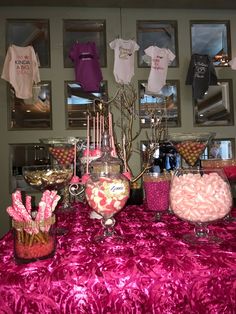 the table is covered with candy and candies