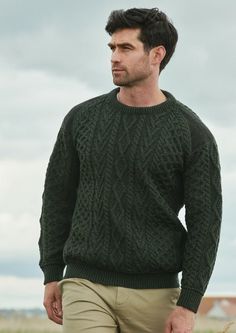 "Aran Crafts Crew Neck Green Tweed Sweater Made from 100% Merino Wool This men's crew neck sweater with insert pockets is knit using the traditional aran stitches of honeycomb and diamond patterns. It is brought up to date with the addition of original Donegal Tweed on the shoulders and elbows of the sweater. Which compliments the sweater beautifully. XS: Chest 32\"-34\" Length 24\" Small: Chest 34\"-38\" Length 25\" Medium Chest: 39-42\" Length 26.5\" Large Chest 42\"-44\" Length 27.5\" XL Ches Dark Green Sweater Outfit, Olive Green Sweater Outfit, Mens Club Outfit, Shirt Under Sweater, Green Sweater Outfit, Sweater Outfits Men, Tweed Sweater, Knit Sweater Outfit, Dark Green Sweater