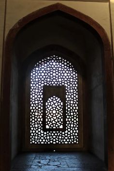 an arched window in the middle of a building