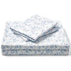 the blue and white floral sheet set is folded on top of each other, with two sheets