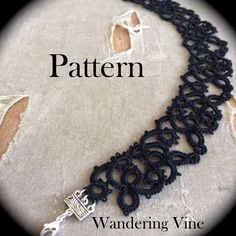 a black crocheted lace necklace on top of a piece of fabric with the words, pattern wandering vine