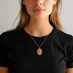 PENDANT INFORMATIONThis pendant is made of real, solid gold.• Made in USA• Material: 14k or 18k solid gold• Finish: polished• Height: 1.24" (31,5 mm) | *includes the small circle, bail dimensions not included• Width: 0.89" (22,5 mm)• Pendant weight: approx. 8 grams (14k)• Bail: fits up to 4 mm chains• Solid back, not hollow• A certificate of authenticity is included• Delivered in our elegant jewelry box, making it the perfect gift Shipping: All of our orders are custom-made. Please allow approxi Spiritual Medallion Necklace With Oval Coin Pendant, Spiritual Oval Coin Pendant Medallion Necklace, St Lazarus, Saint Lazarus, St Michael Pendant, Phoenix Pendant, Gold Dragon, Solid Gold Necklace, Small Circle