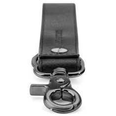 Keep your keys exactly where you want them with this black leather key holder.  Designed with a swivel hook, it easily attaches to your backpack, messenger bag or belt bag and includes a separate keyring for your keys.  Your key holder is an extension of your style… it’s all in the details.  Constructed in durable leather and hard-wearing metal. Designed in Denmark. Black Keychain With Key Clip For Everyday Use, Black Keychains With Interior Key Chain Holder, Modern Keychain With Key Clip, Leather Keychains With Key Leash For Everyday Use, Leather Keychain With Key Leash, Everyday Leather Keychain With Key Clip, Swivel Hook, Leather Key Holder, Leather Key