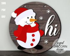 a wooden sign with a snowman wearing a santa hat and scarf on it's face