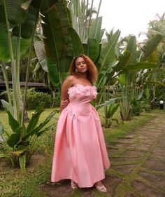 This Light Pink Strapless Gown with Floral Appliqué Bodice is designed to make you feel like royalty, this gown features a delicate strapless neckline that beautifully showcases your shoulders and collarbone. The bodice is adorned with intricate handmade floral appliqué, adding a touch of romantic elegance and texture to the ensemble. The full flowing skirt gracefully drapes from the fitted waist, creating a timeless silhouette that exudes sophistication. Perfect for weddings, galas, or any spec Summer Party Gown With Pleated Bodice, Strapless Ball Gown For Prom Party, Summer Gala Gown With Pleated Bodice, Strapless Ball Gown Dress For Prom Season Party, Strapless Ball Gown For Prom Season Party, Pleated Bodice Maxi Dress For Prom Season, Strapless Ball Gown With Pleated Bodice For Party, Feminine Pleated Bodice Evening Dress For Party, Summer Cocktail Gown With Pleated Bodice