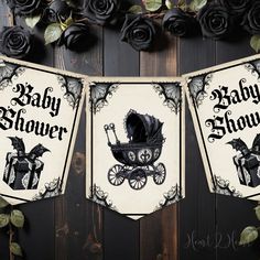 two baby shower banners hanging on a wooden wall with roses in the background and an image of a stroller