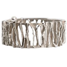 A Scandinavian Modern Silver bracelet with polished and etched openings from Denmark by C. Holm. Measures: Diameter: 2.5". Height: 1". Silver Bracelet Designs, Architectural Jewelry, Malachite Bracelet, Scandinavian Jewelry, Modern Bracelets, Organic Jewelry, Ceramic Necklace, Modernist Jewelry, Bronze Jewelry