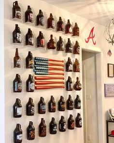 an american flag made out of beer bottles on a wall