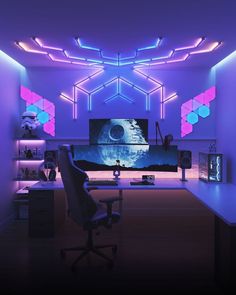 an office with purple and blue lighting on the walls