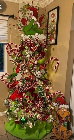 a christmas tree decorated with candy canes and candies