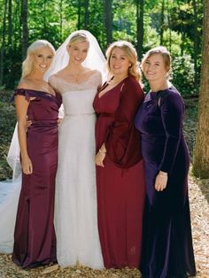 three women in dresses standing next to each other with one woman wearing a wedding dress